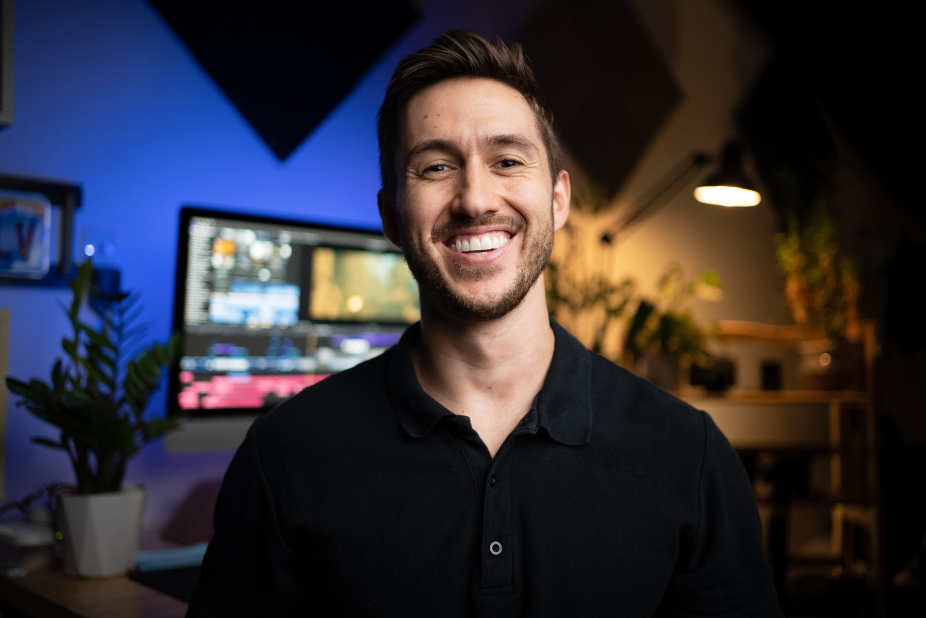 Dylan John Dickerson smiling in his edit suite